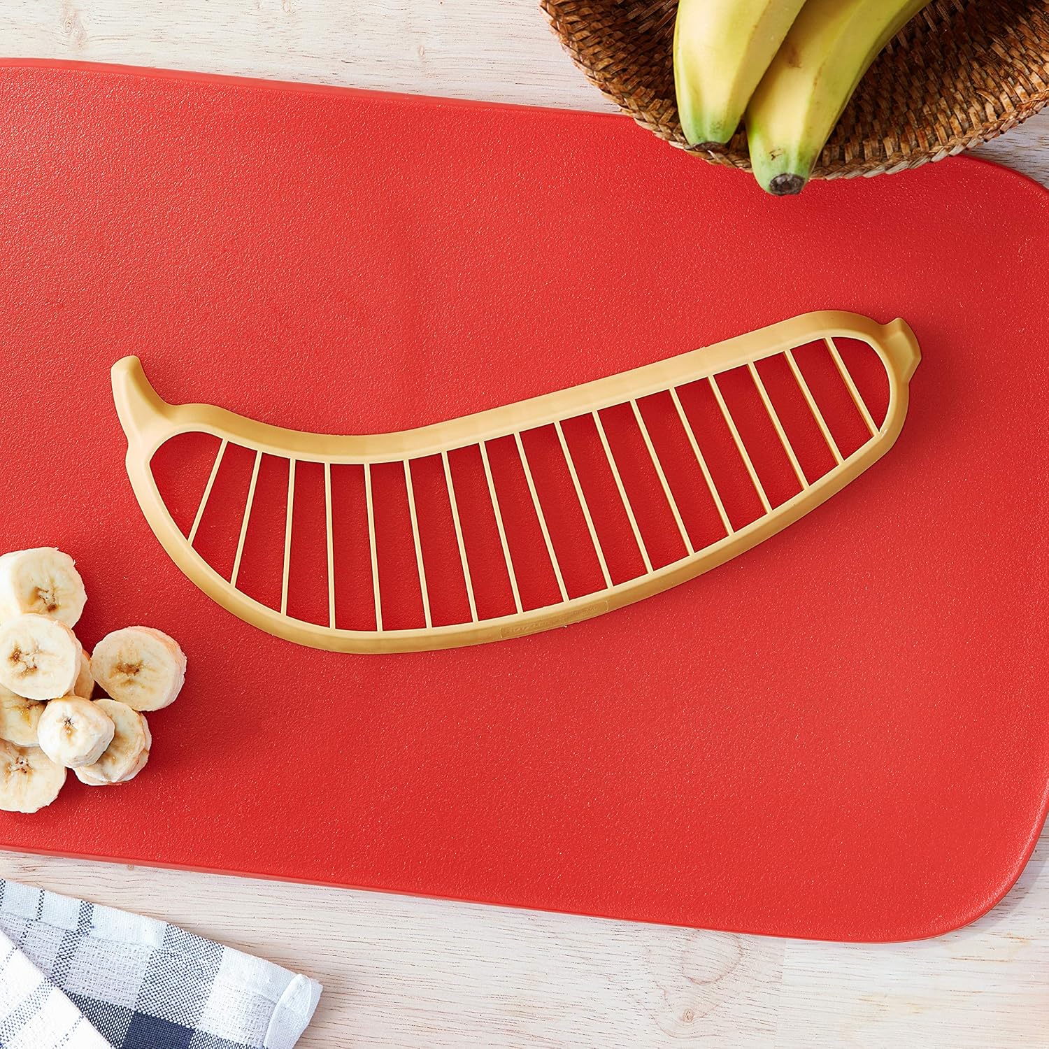 Banana slicer tool on cutting board for quick and even banana slices